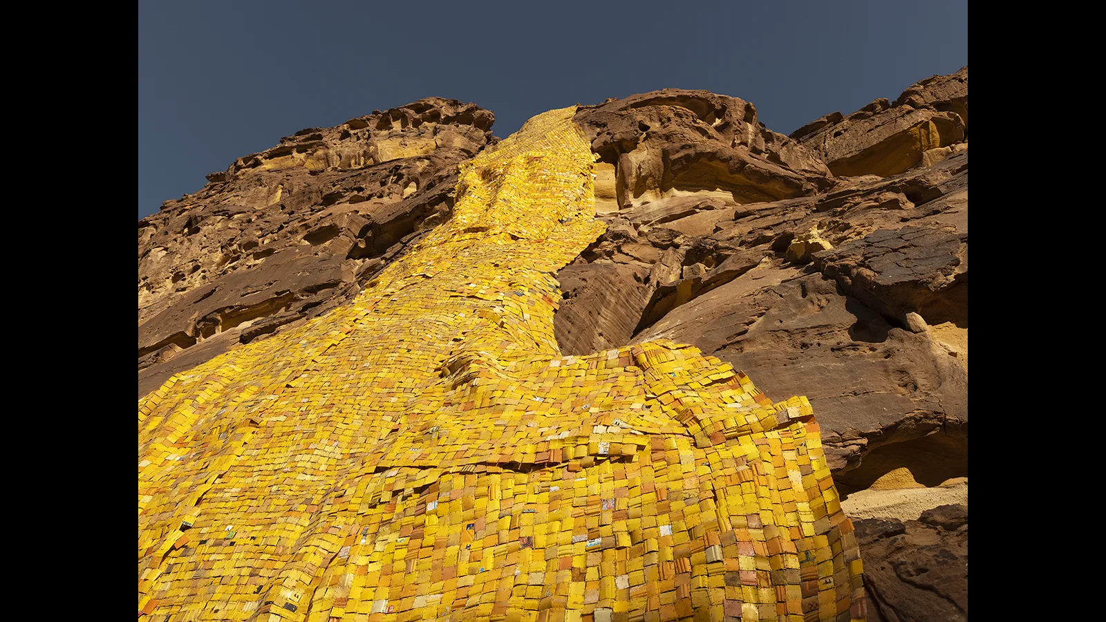 Serge Attukwei Clottey Gold Falls, Installation View, Desert X AlUla 2022, courtesy the artist and Desert X AlUla, photo by Lance Gerber